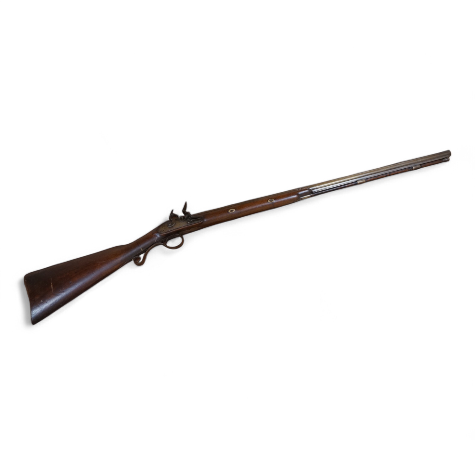 A single barrel flintlock sporting gun by Manton, half stocked, with signed lock and rainproof pan, platinum lined vent, and iron furniture (worn smooth)
